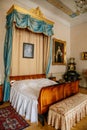 Castle interior. Bedroom with blue ÃÂanopy bed. Castle Duchcov, Czech Republic